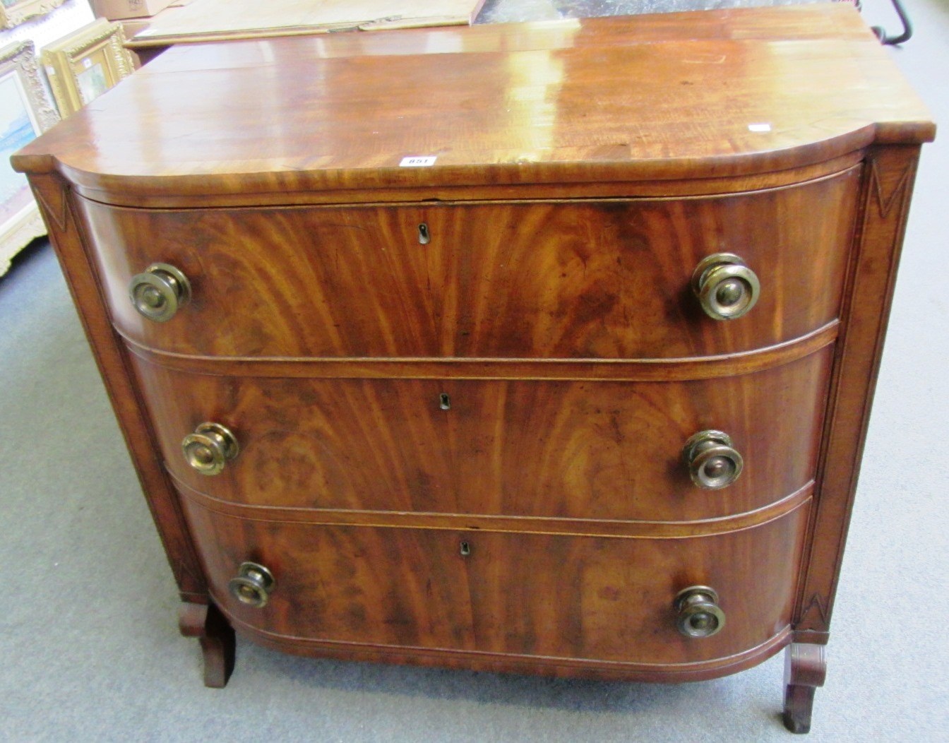 Appraisal: An early th century French mahogany three drawer bowfront chest