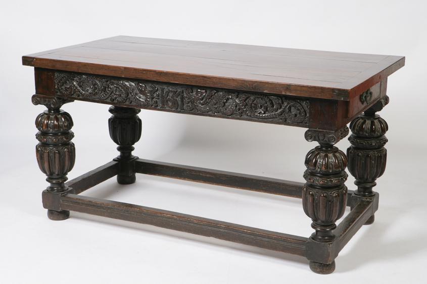 Appraisal: A CHARLES II STYLE OAK DINING TABLE the rectangular plank