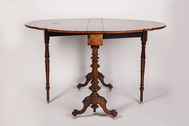 Appraisal: A VICTORIAN WALNUT AND SATINWOOD INLAID SUTHERLAND TABLE with two