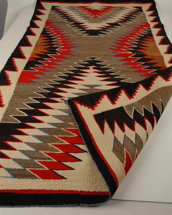 Appraisal: A Navajo Rug in a zigzag pattern in reds dark