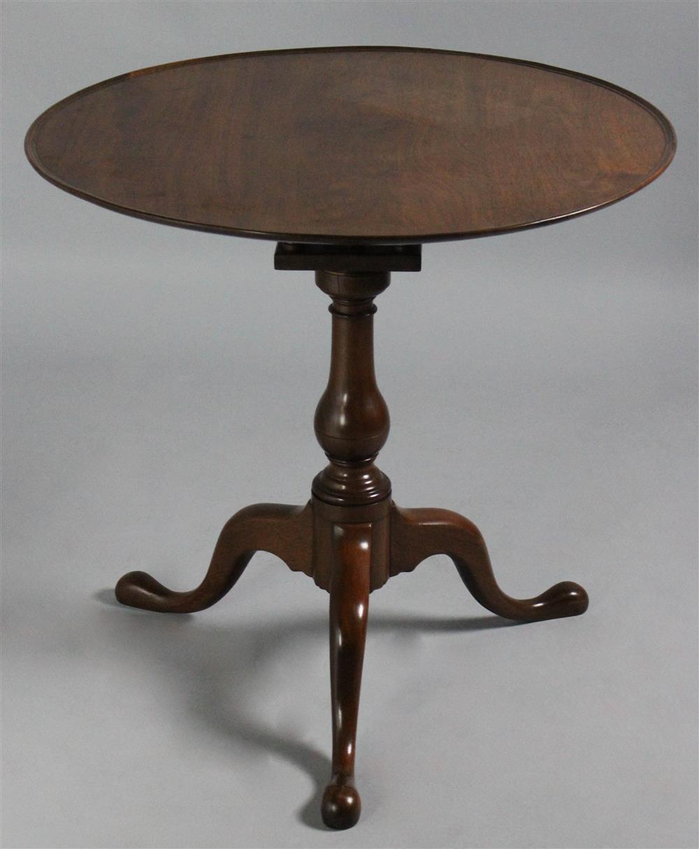 Appraisal: GEORGIAN MAHOGANY DISH TOP TEA TABLE with a round dished