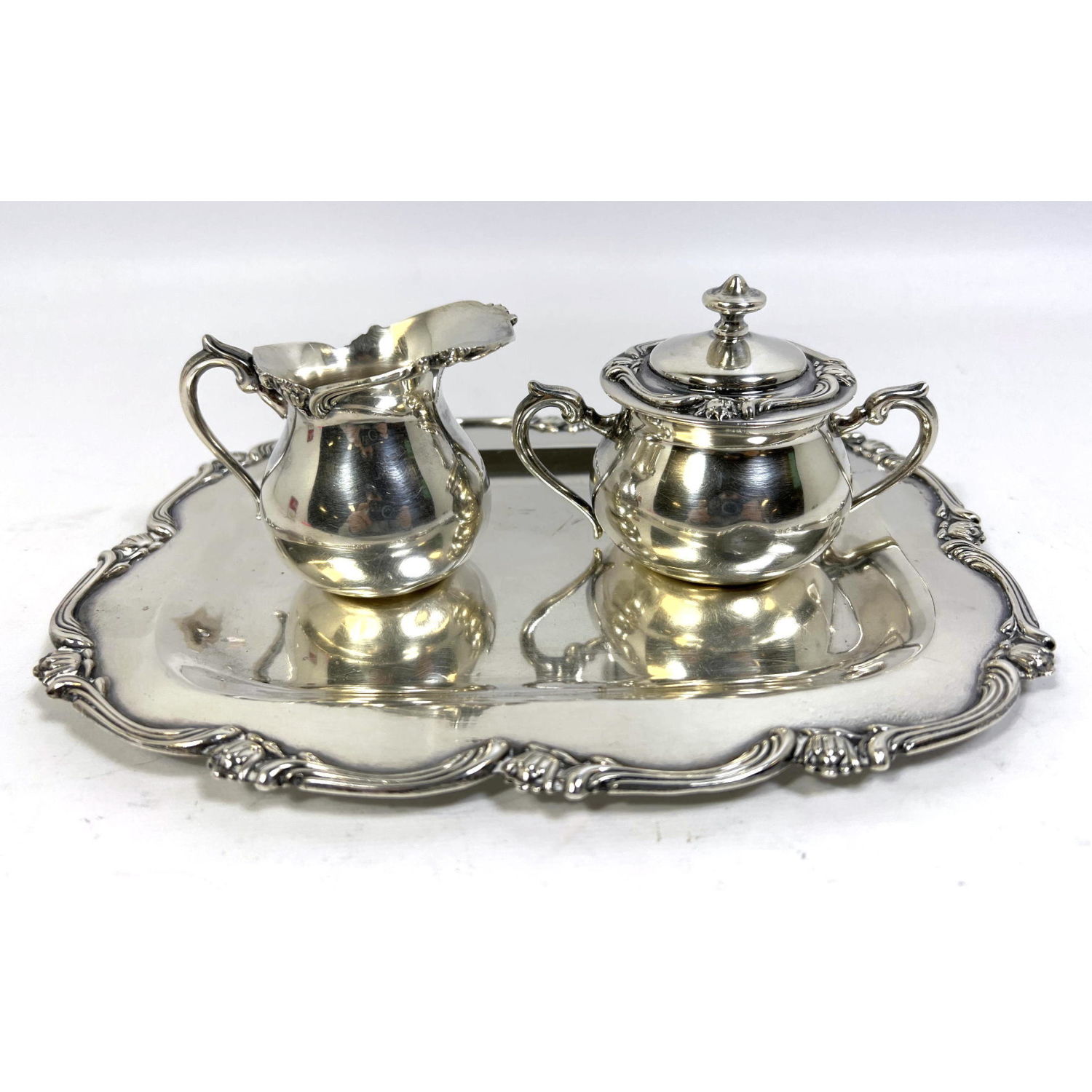 Appraisal: PERUVIAN STERLING SILVER CREAMER SUGAR AND TRAY INDUSTRIA PERUANA CAMUSSO