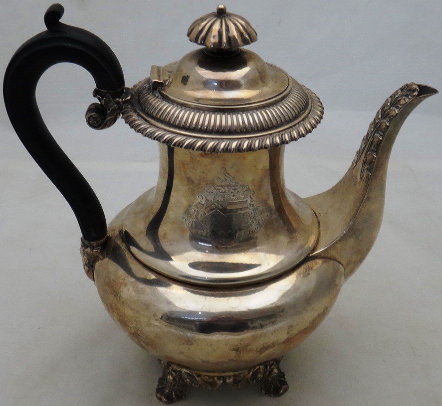 Appraisal: A Victorian silver coffee pot with a foliate capped spout