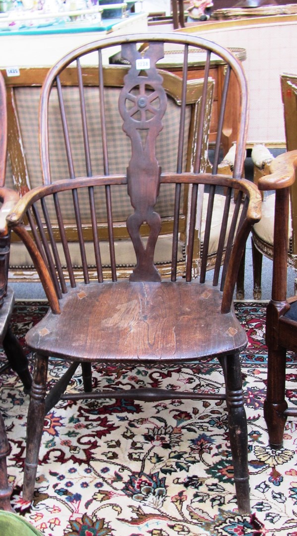 Appraisal: An early th century ash and elm wheel back Windsor