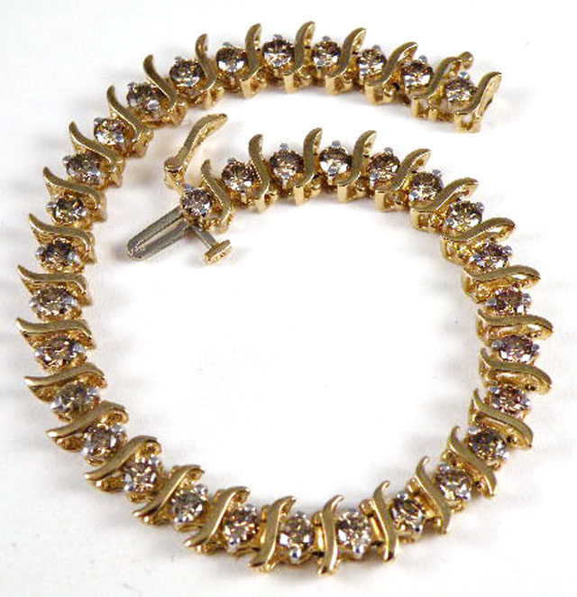 Appraisal: DIAMOND AND FOURTEEN KARAT GOLD LINE BRACELET with S-form links