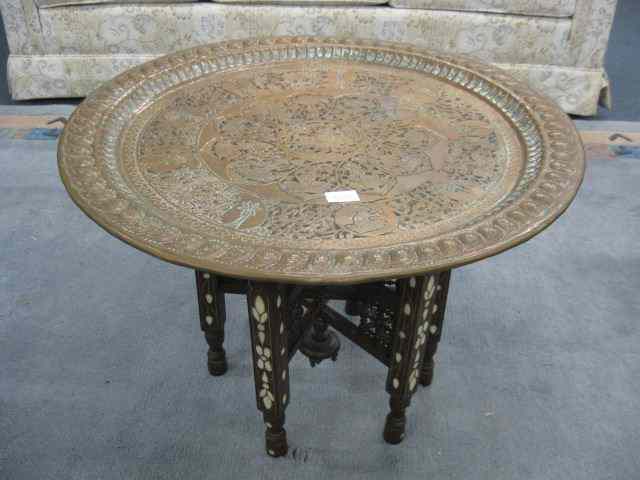 Appraisal: Islamic Coffee Table elaborate handhammered engraved round copper top on