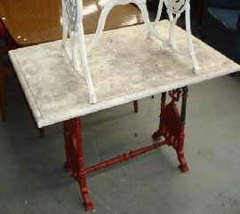 Appraisal: A painted wrought iron and marble side table