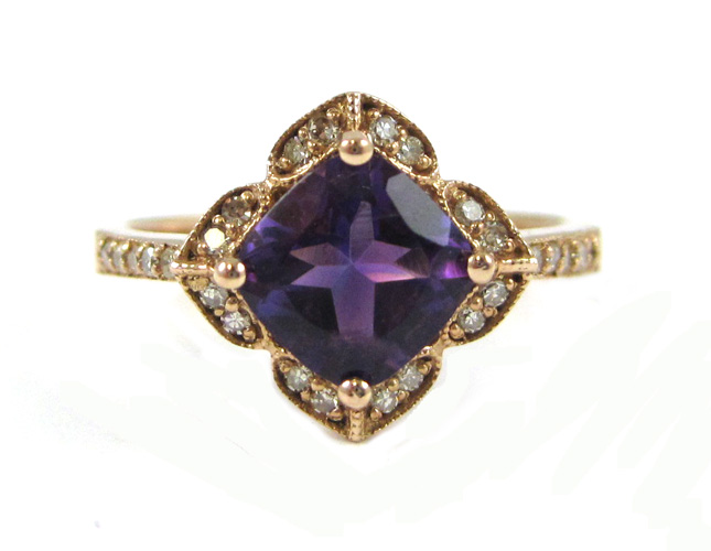 Appraisal: AMETHYST AND FOURTEEN KARAT ROSE GOLD RING with round-cut diamonds