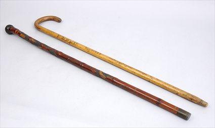 Appraisal: JAPANESE CARVED BAMBOO WALKING STICK AND A CANE The first