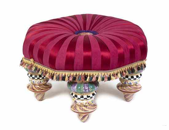 Appraisal: A MacKenzie-Childs Upholstered and Ceramic Ottoman the striped upholstered seat