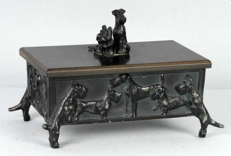 Appraisal: Cigarette Box with Embossed Scotties Description Spelter and Bakelite Made