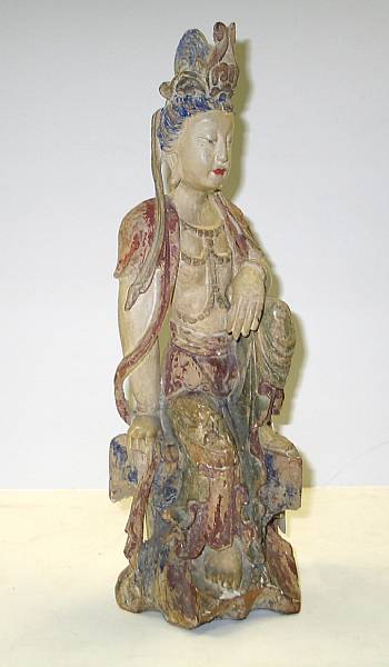 Appraisal: A Song style polychrome wood figure of Guanyin Portrayed seated