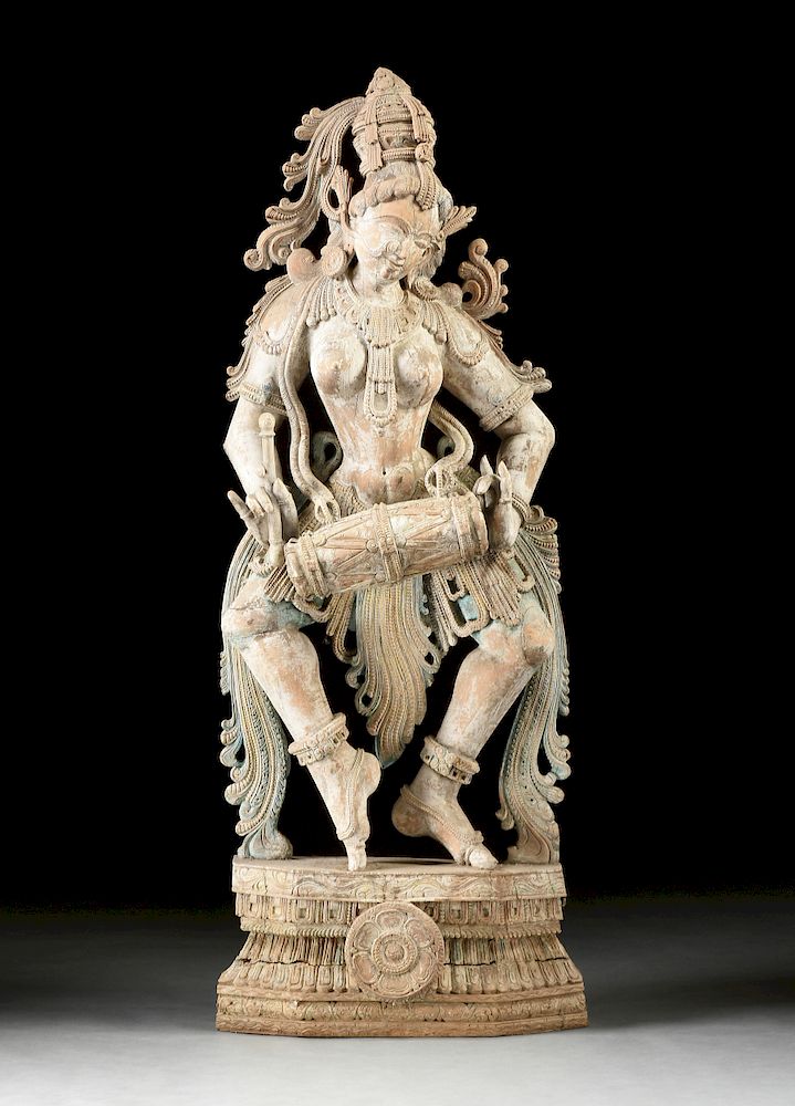 Appraisal: A SOUTHERN INDIAN POLYCHROME WOOD SCULPTURE OF A DANCING FIGURE