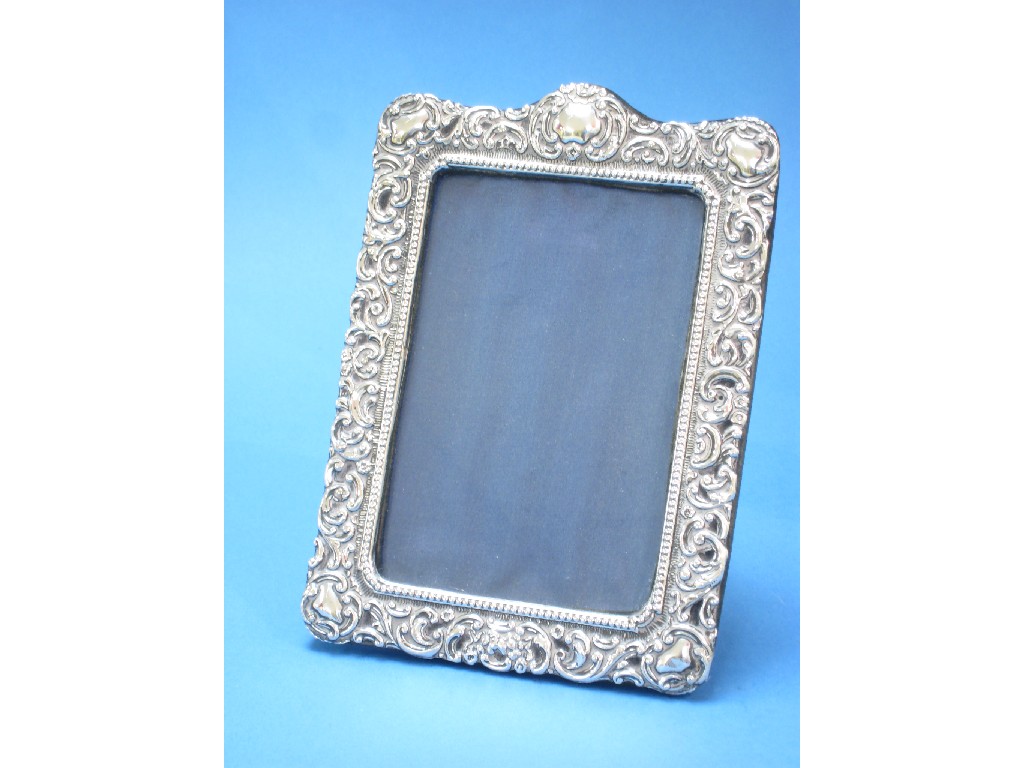 Appraisal: A Victorian Photograph Frame floral and scroll embossed x in