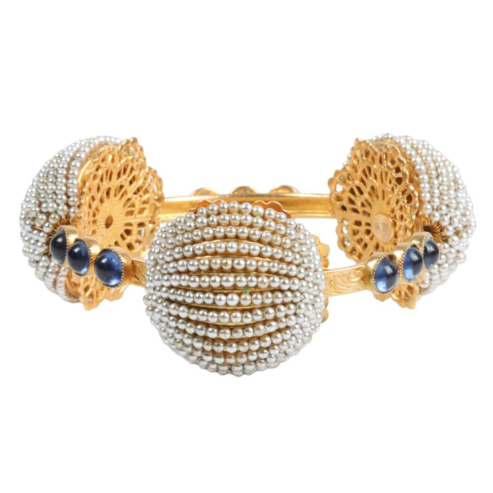 Appraisal: DELILLO BANGLE BRACELET WITH THREE DOMED PAVE SEED PEARL STATIONS