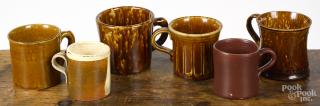 Appraisal: Four Bennington flint enamel mugs together with a redware frog