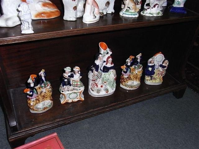 Appraisal: A PAIR OF VICTORIAN STAFFORDSHIRE HIGHLAND DANCING FIGURE GROUPS other