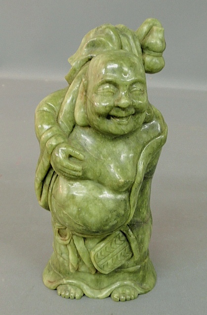 Appraisal: - Asian carved green hard stone figure of a wise