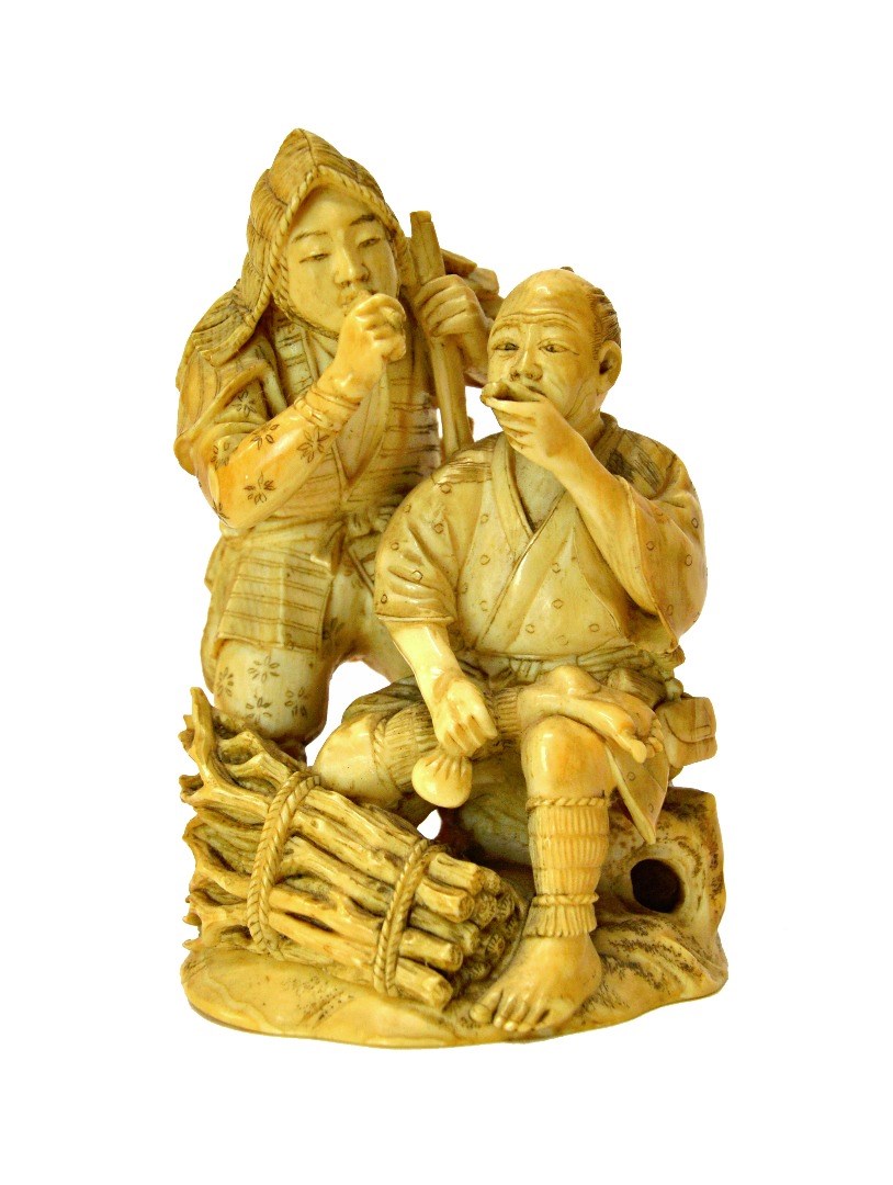 Appraisal: A Japanese ivory okimono Meiji period carved as two figures