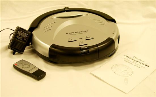 Appraisal: iTouchless round robot vacuum remote control and charger included some