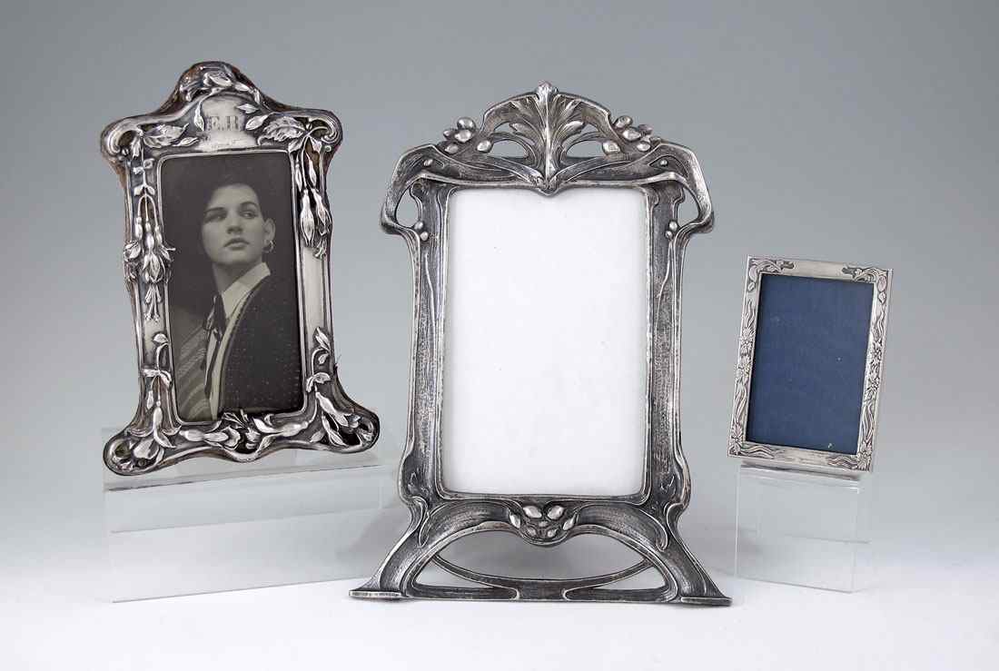 Appraisal: ART NOUVEAU STERLING PHOTO FRAMES Smallest marked with I N