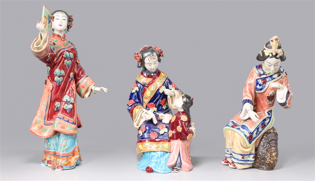 Appraisal: Group of three Chinese porcelain figures girl with child chipped