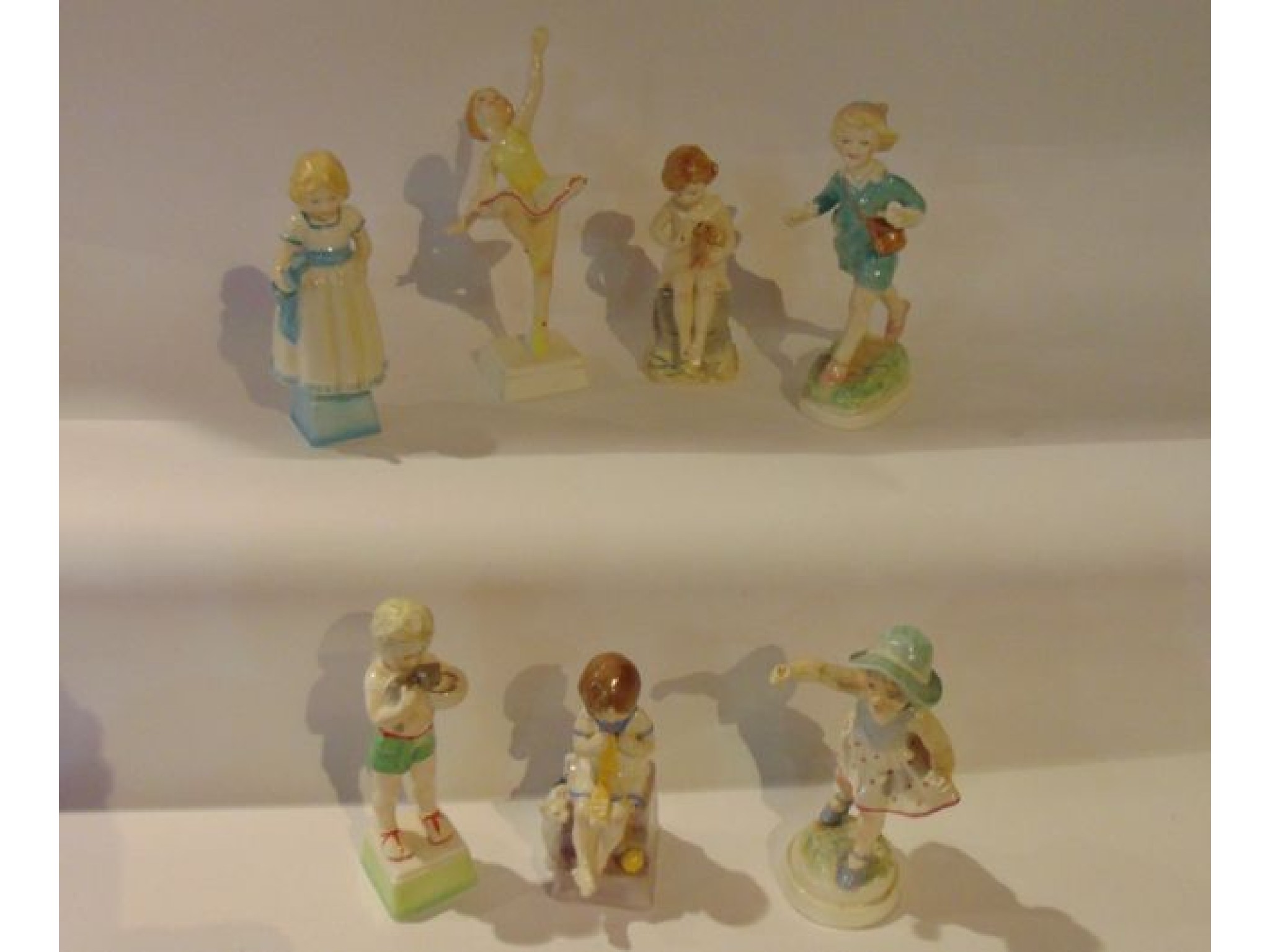 Appraisal: A set of seven Royal Worcester figures of children representing