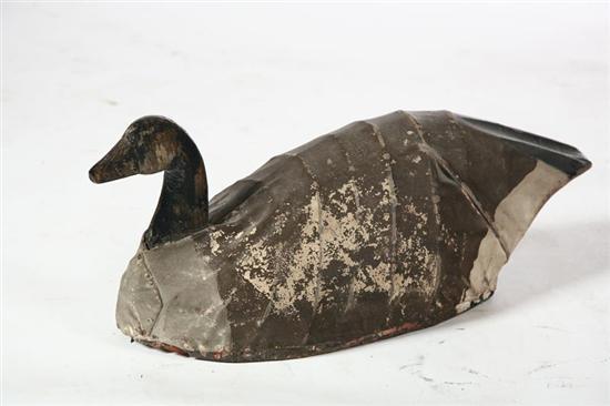 Appraisal: CANADA GOOSE DECOY American th century canvas Wooden base and