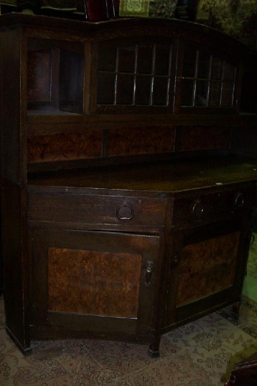 Appraisal: A liberty Co oak sideboard the lower section of breakfront