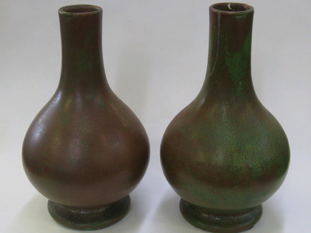 Appraisal: Pair of Dunmore pottery bottle vases in red and green