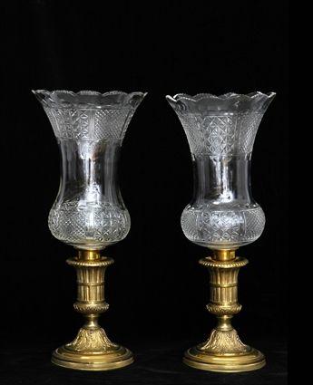 Appraisal: PAIR OF NEOCLASSICAL-STYLE GILT-BRONZE CANDLE HOLDERS WITH CUT GLASS SHADES