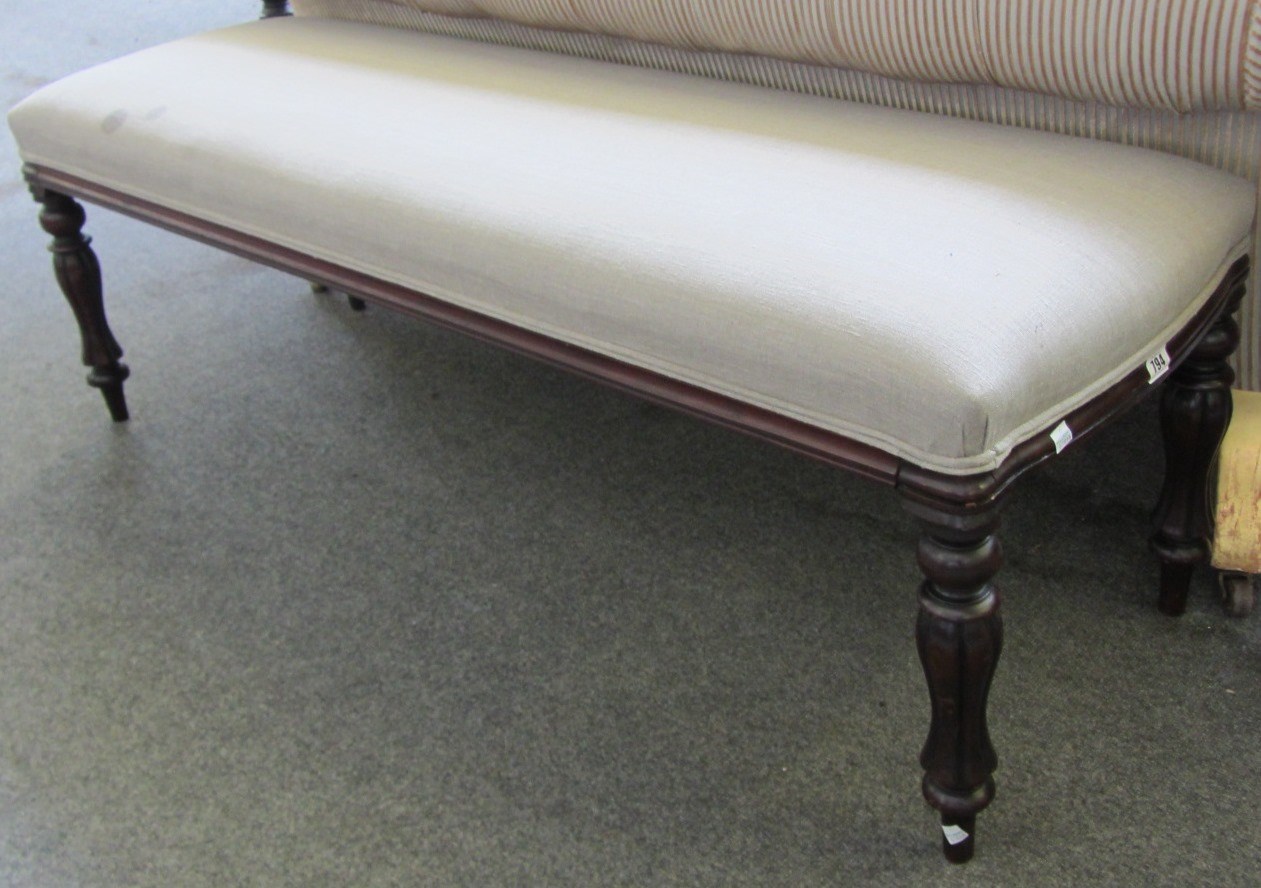 Appraisal: A large rectangular mahogany framed foot stool on reeded baluster