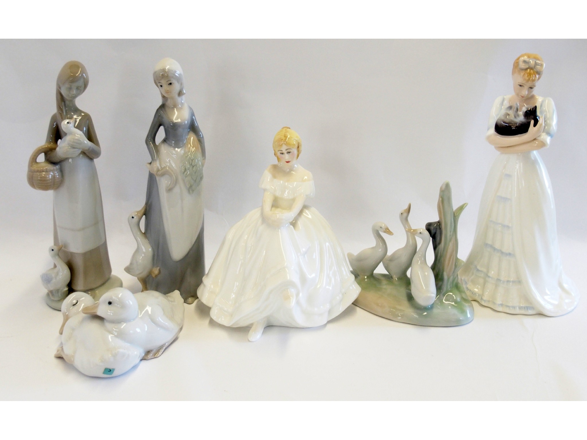 Appraisal: Two Royal Doulton figures Heather and Kimberley two Nao figures