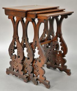 Appraisal: Nest of three rosewood Victorian tables with pierce carved ends