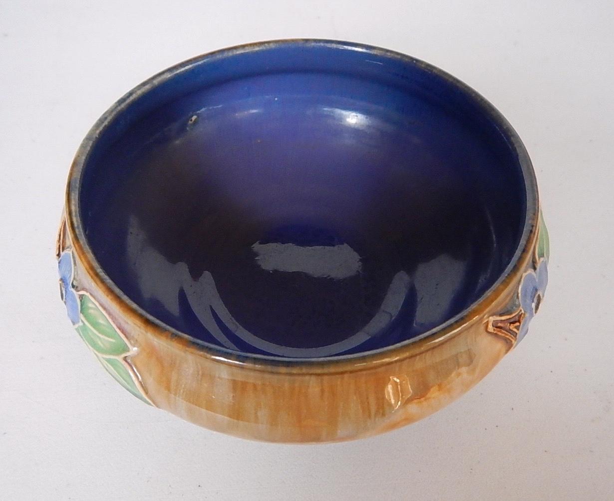 Appraisal: A Royal Doulton stoneware bowl with floral sprays on a