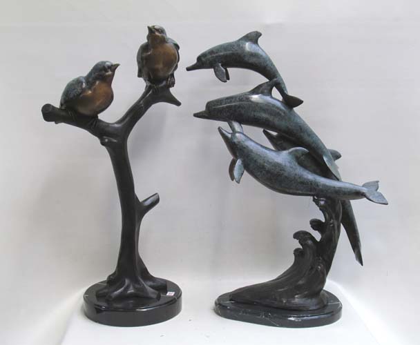 Appraisal: TWO WILDLIFE BRONZE SCULPTURES a marbleized polychrome enamel dolphin group