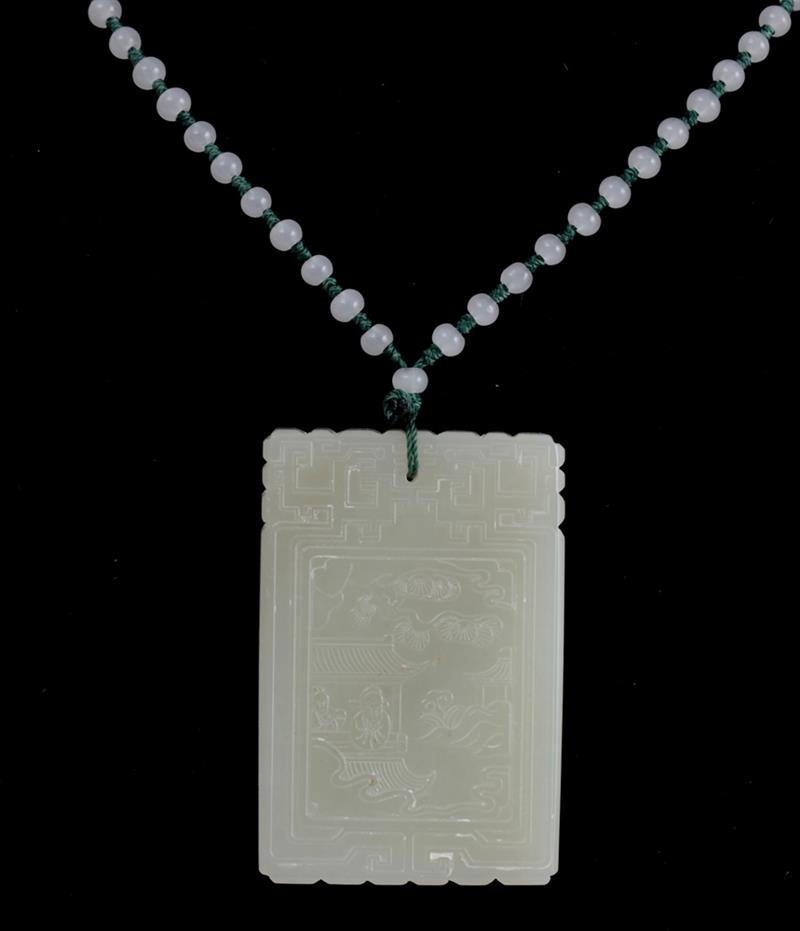 Appraisal: CHINESE CARVED WHITE JADE PENDANT Relief carved at the front