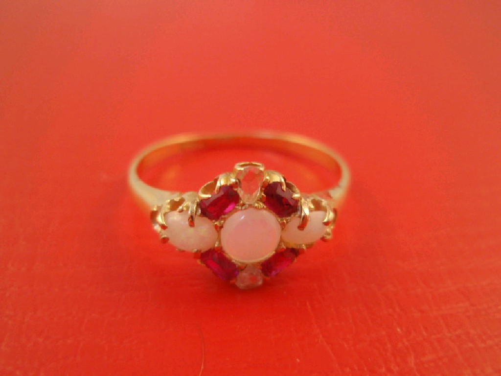 Appraisal: An opal diamond and ruby cluster dress ring in ct