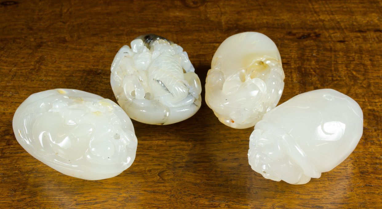 Appraisal: FOUR CHINESE CARVED AGATE HARDSTONES in various carved themes of