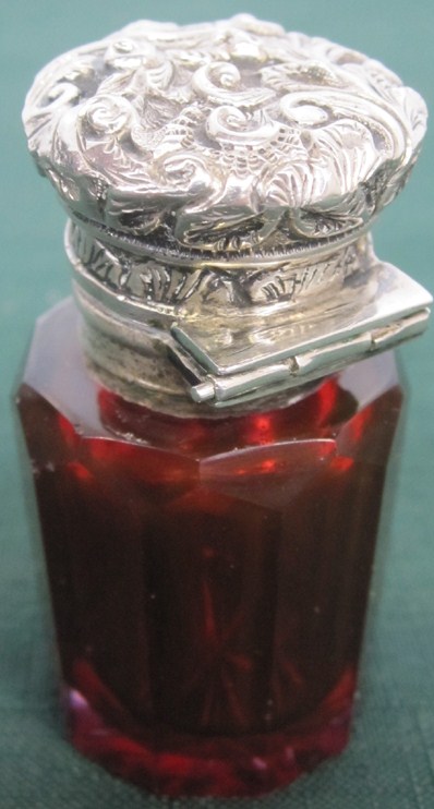 Appraisal: SILVER CAPPED PERFUME FLASK Faceted ruby crystal with continental silver