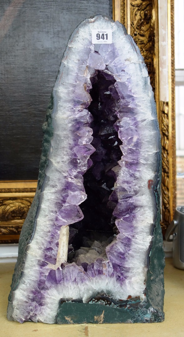 Appraisal: Three amethyst quartz geodes of typical naturalistic form the largest