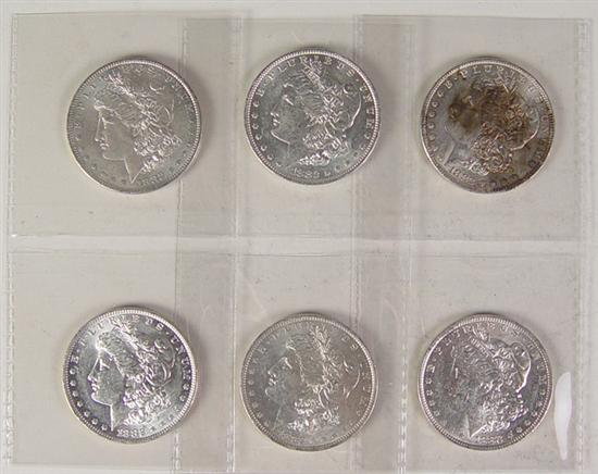 Appraisal: Six -O Morgan Dollars These coins grade AU-AU Showing small