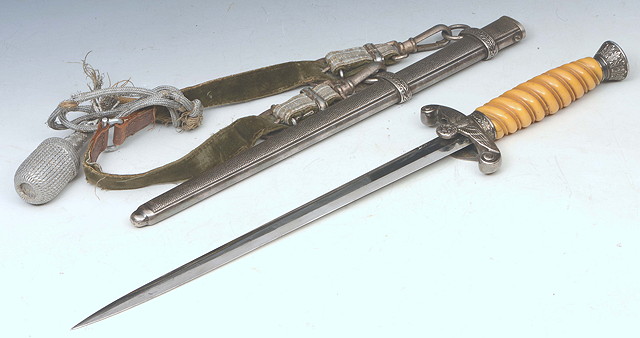 Appraisal: A NAZI OFFICER'S DAGGER with turned bone handle decorated scabbard