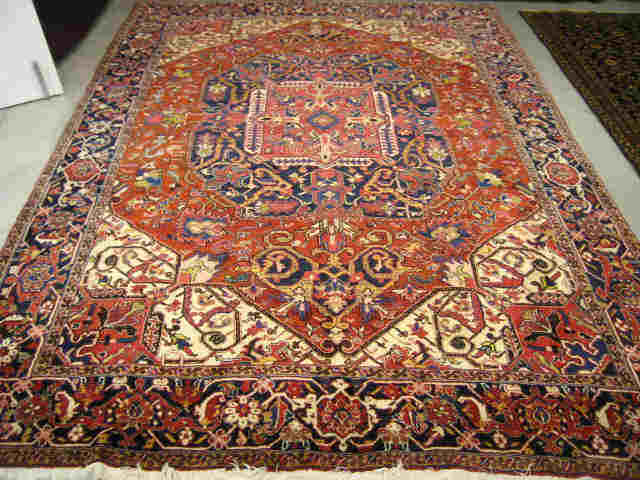 Appraisal: Heriz Persian Handmade Room Size Rug fancy geometrics stylized floral