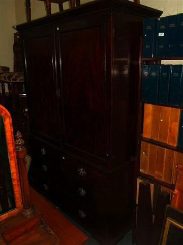 Appraisal: A th century mahogany linen press the upper section with