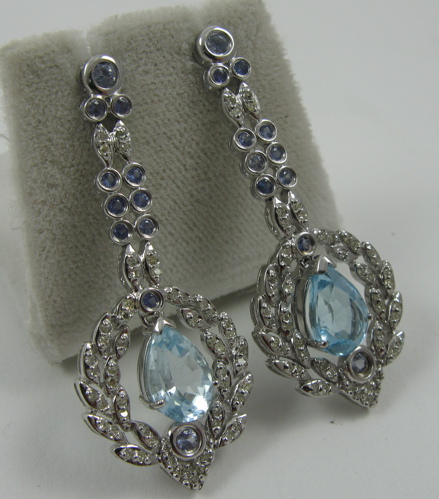 Appraisal: PAIR OF DIAMOND AND BLUE TOPAZ PENDANT EARRINGS K white