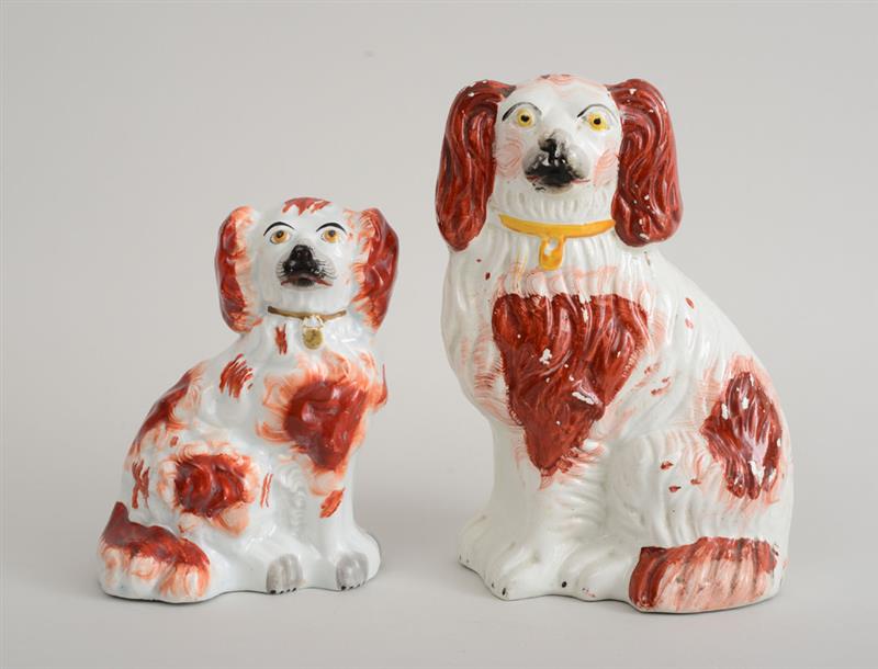 Appraisal: TWO STAFFORDSHIRE PEARLWARE FIGURES OF SEATED SPANIELS Each with iron