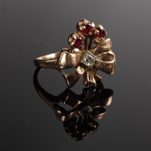 Appraisal: Edwardian rose gold K diamond and ruby floral bow ring