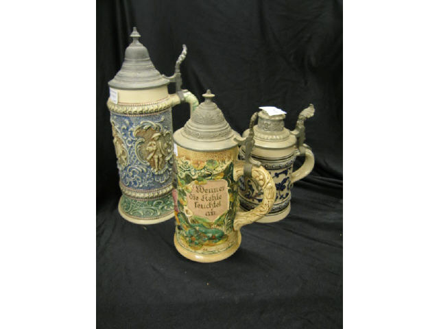 Appraisal: German Pottery Steins gnomes courting scenes and shield designs liter