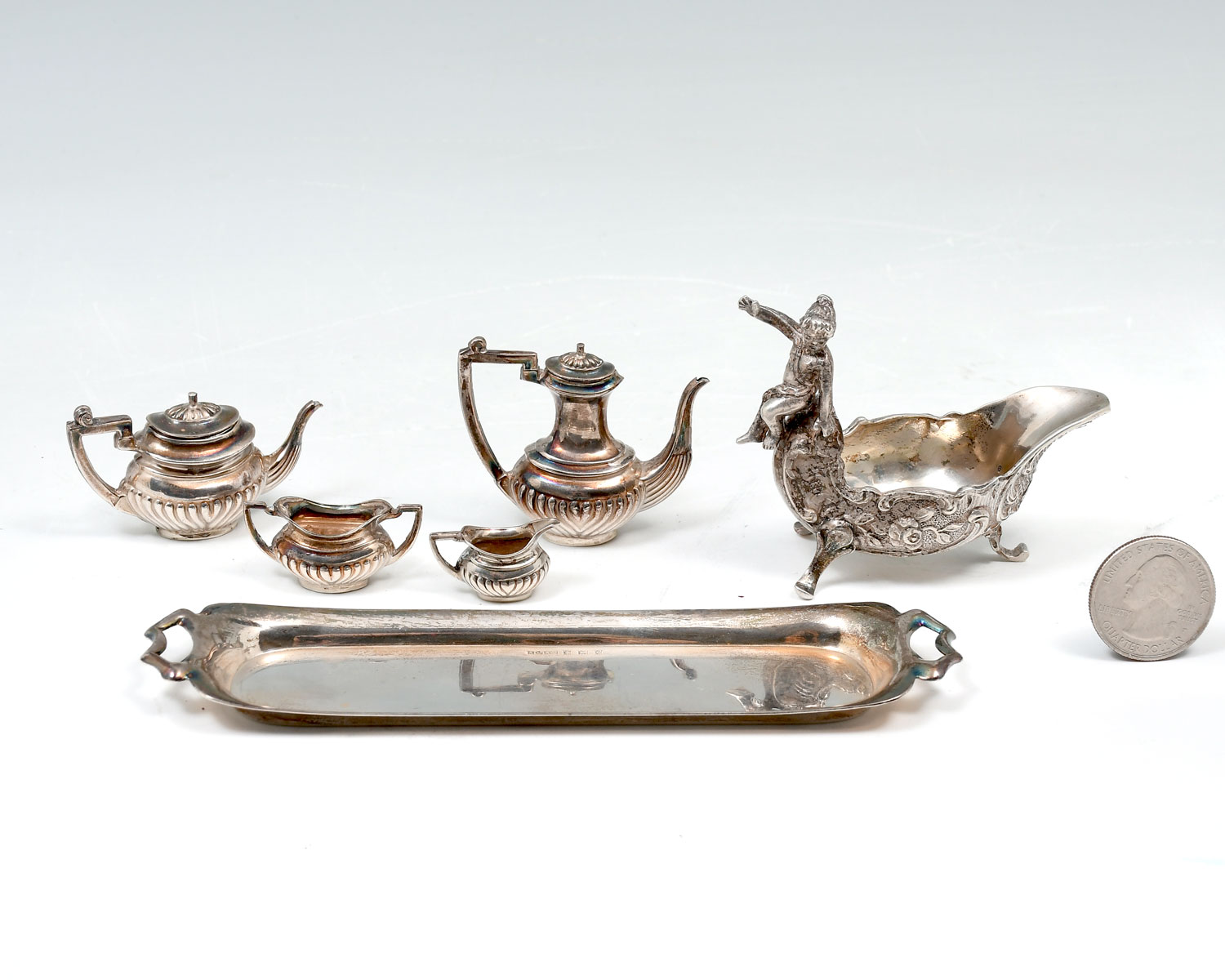 Appraisal: STERLING CHERUB CREAMER AND MINIATURE TEA SET Approx Troy ounces